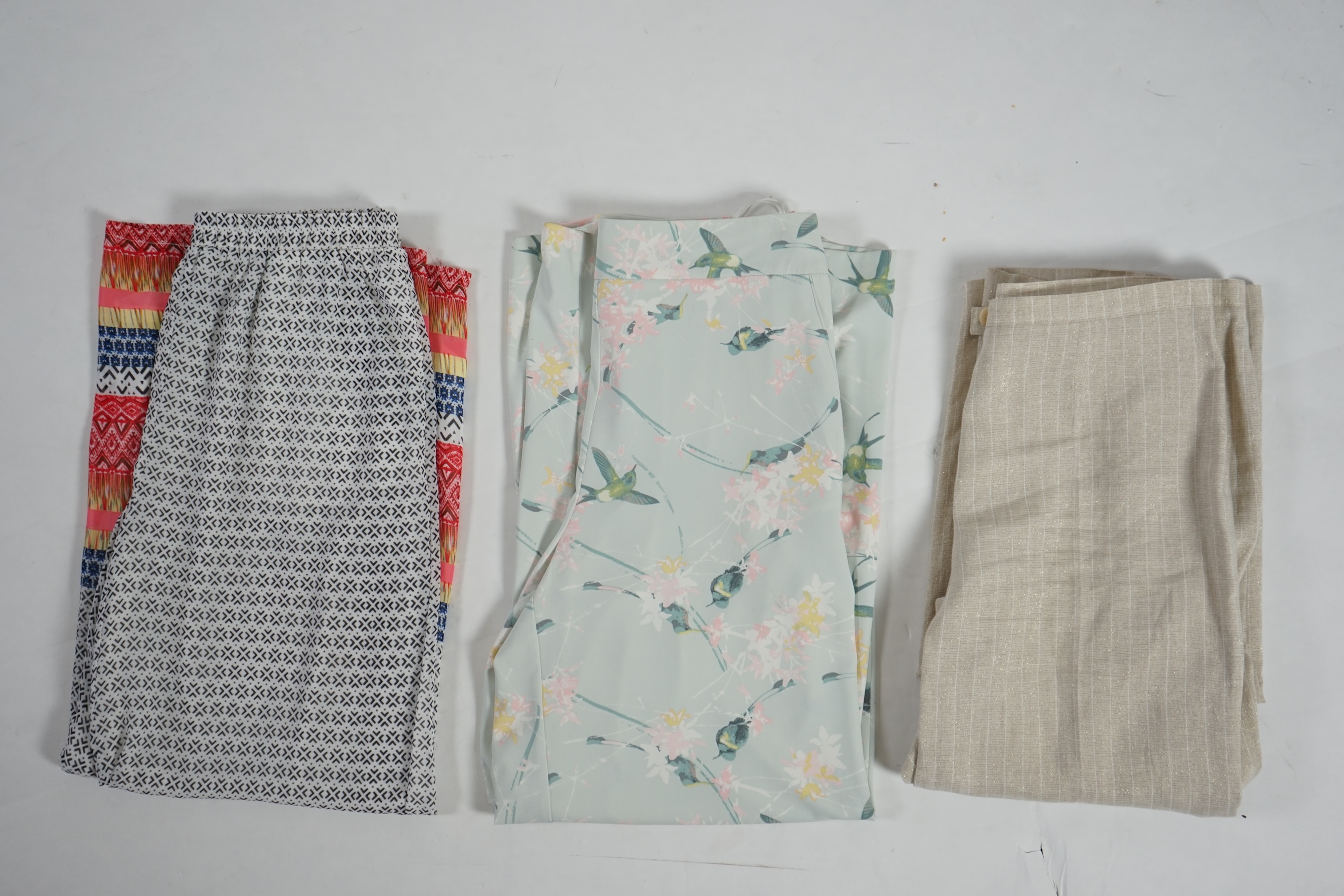 Three pairs of lady's casual trousers. Approx size 14-16 Proceeds to Happy Paws Puppy Rescue
